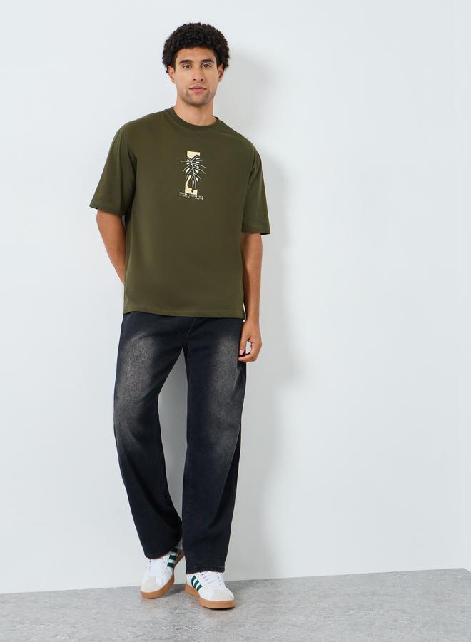 Styli Men Green Graphic Print Oversized T-Shirt - Image 1